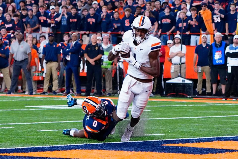 Virginia Cavaliers wide receiver Lavel Davis Jr. (1) catches a pass for a touchdown against the Syracuse Orange during the second half at JMA Wireless Dome in  Syracuse, N.Y. on Sept. 23, 2022,