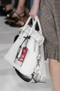 <p><i>White handbag with leather travel tags attached from the SS18 Maison Margiela collection. (Photo: ImaxTree) </i></p>