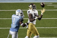 Notre Dame wide receiver Javon McKinley (88) catches a pass as North Carolina defensive back Kyler McMichael (1) defends during the second half of an NCAA college football game in Chapel Hill, N.C., Friday, Nov. 27, 2020. (AP Photo/Gerry Broome)