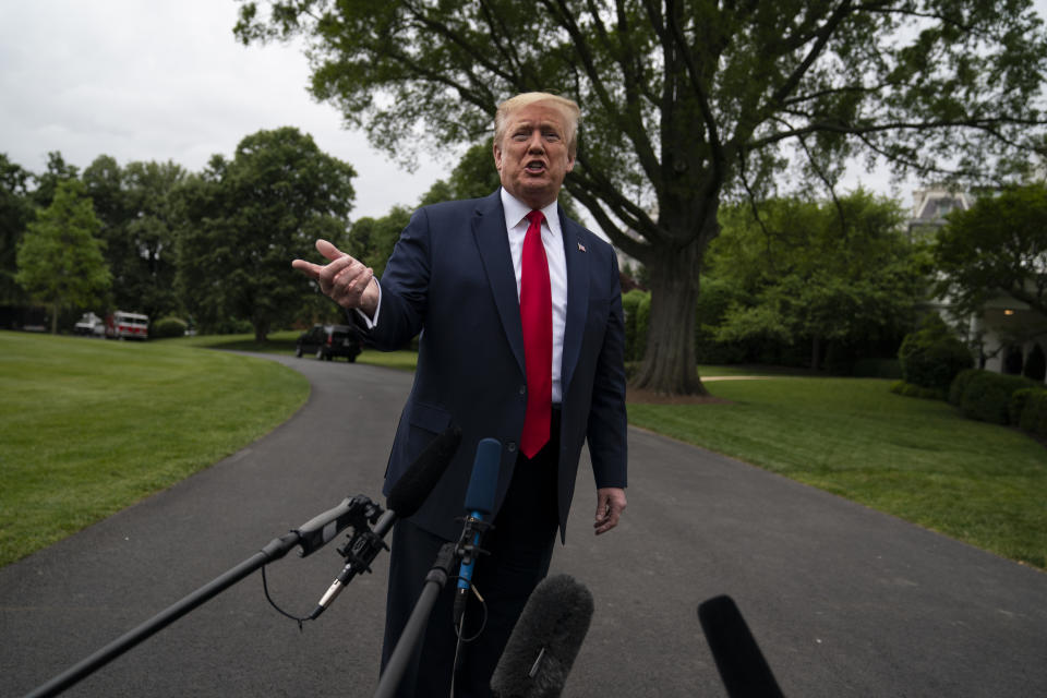 President Donald Trump talks to reporters before departing the White House for a trip to Michigan, Thursday, May 21, 2020, in Washington. (AP Photo/Evan Vucci)