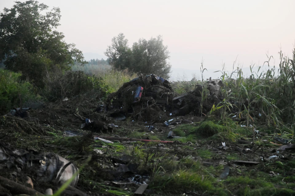 Debris of an Antonov cargo plane is seen in Palaiochori village in northern Greece, Sunday, July 17, 2022, after it reportedly crashed Saturday near the city of Kavala. The An-12, a Soviet-built turboprop aircraft operated by the Ukrainian cargo carrier Meridian, crashed late Saturday as Greek Civil Aviation authorities said the flight was heading from Serbia to Jordan. (AP Photo/Giannis Papanikos)