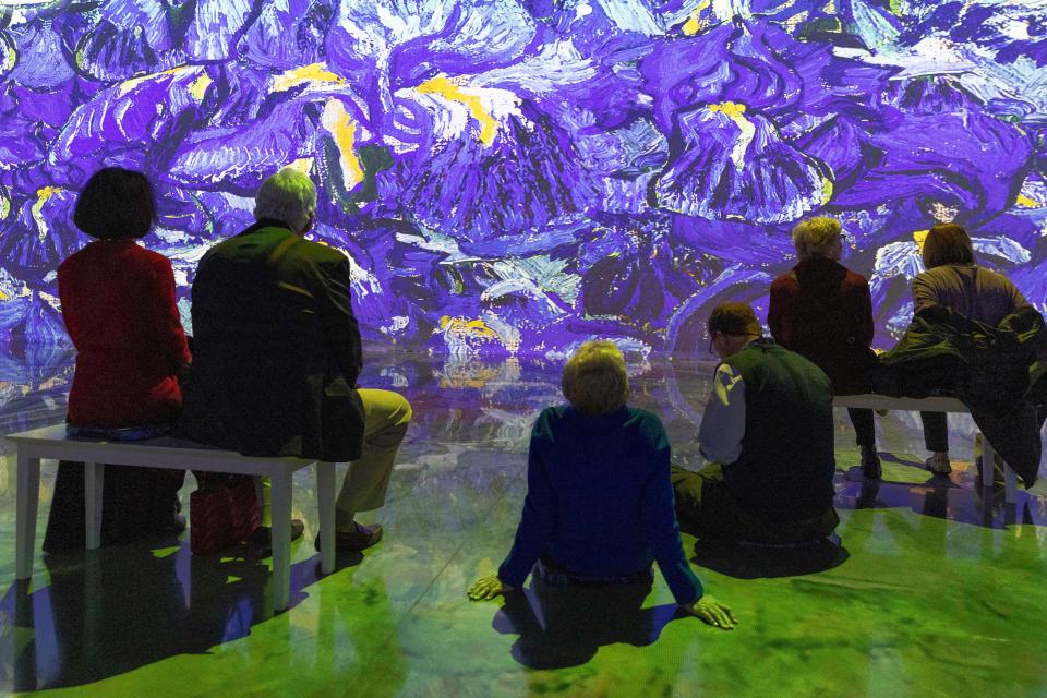 People watch the "Immersive Van Gogh" exhibit Dec. 15 at the Oklahoma City Convention Center.