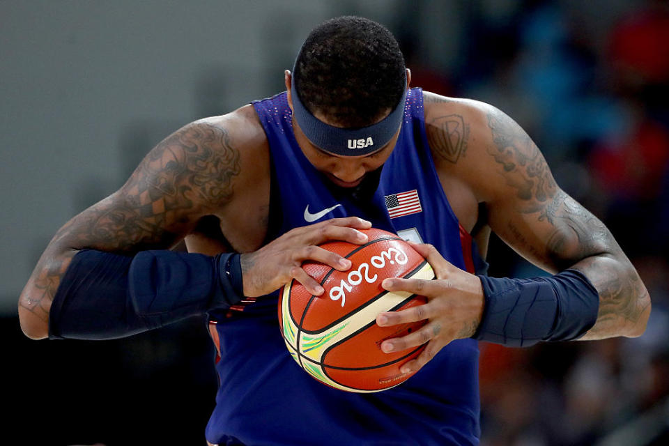 Carmelo Anthony stands on the court prior to the semifinal match against Spain. (Getty)