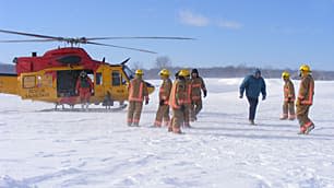 Wyoming, Ont., firefighters work to rescue stranded motorists near Sarnia.