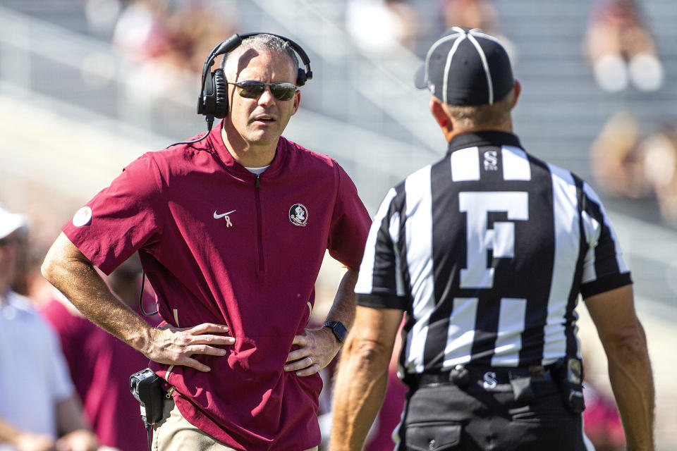 Florida State head coach Mike Norvell questions the field judge in the second half of an NCAA college football game against Massachusetts in Tallahassee, Fla., Saturday, Oct. 23, 2021. Florida State defeated UMass 59-3. (AP Photo/Mark Wallheiser)