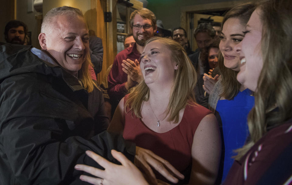 Republican congressional candidate Denver Riggleman is joined by his three daughters center Abby, Lilly and Lauren during an election party in Afton, Va., Tuesday, Nov. 6, 2018. (AP Photo/Lee Luther Jr.)