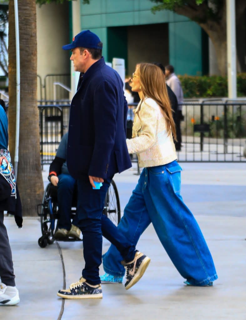 Jennifer Lopez Makes a Compelling Case For Wearing Impractical Sequin Boots at a Basketball Game