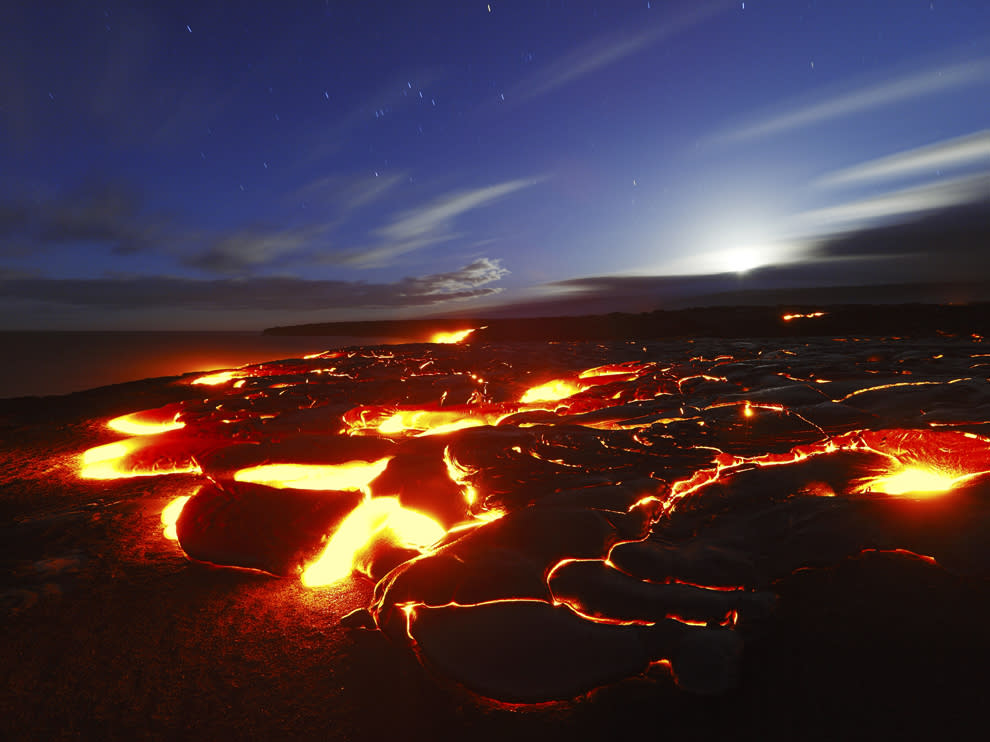 Molten lava advances to ocean at dawn, Kilauea. Hawaii.Credit: Photograph by Toshi Sasaki, Getty Images