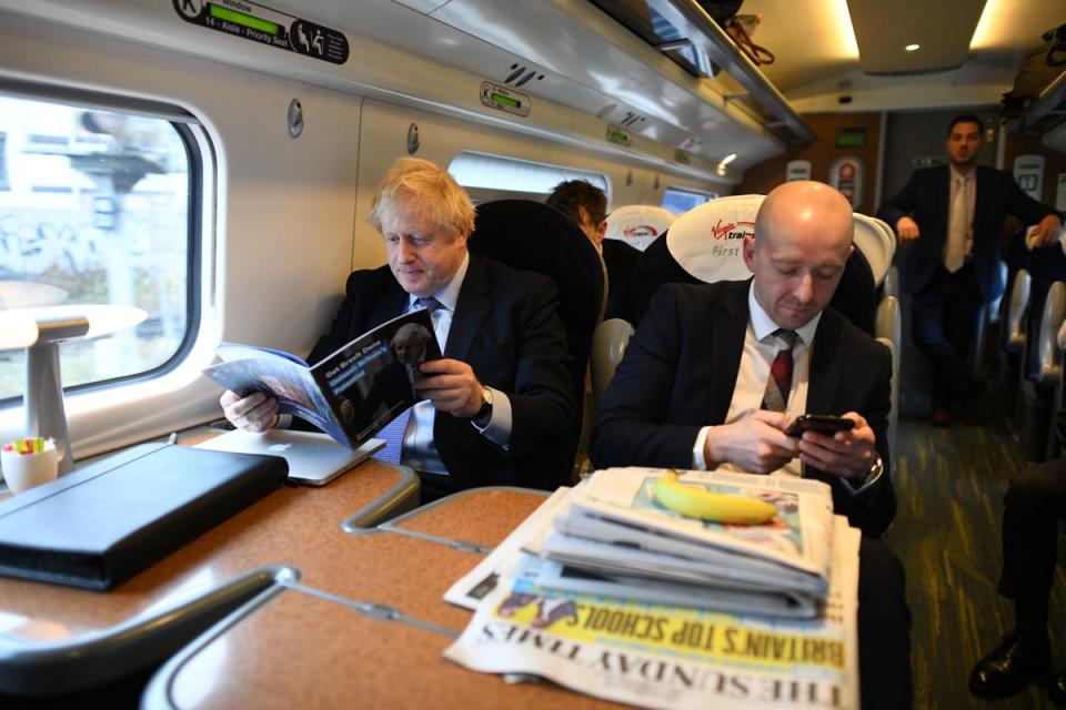 Boris Johnson with Lee Cain (PA)