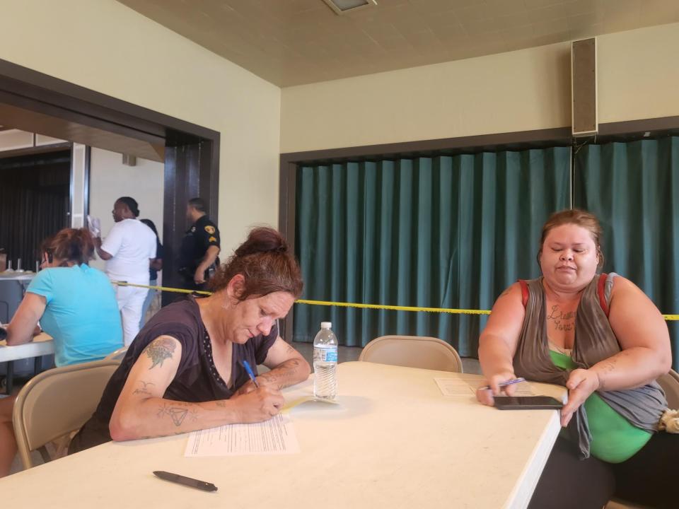 Tiffany Eschette and Jennifer Billiot filled out forms to apply for Housing and Urban Development vouchers, June 30. 500 applicants were filled out in under three hours.