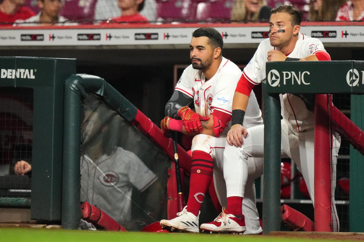 Cincinnati Reds first base Christian Encarnacion-Strand (33) and Cincinnati Reds outfielder TJ Friedl (29) stand at the top of the dugout steps in the ninth inning of a baseball game between the Arizona Diamondbacks and Cincinnati Reds, Tuesday, May 7, 2024, at Great American Ball Park in Cincinnati.