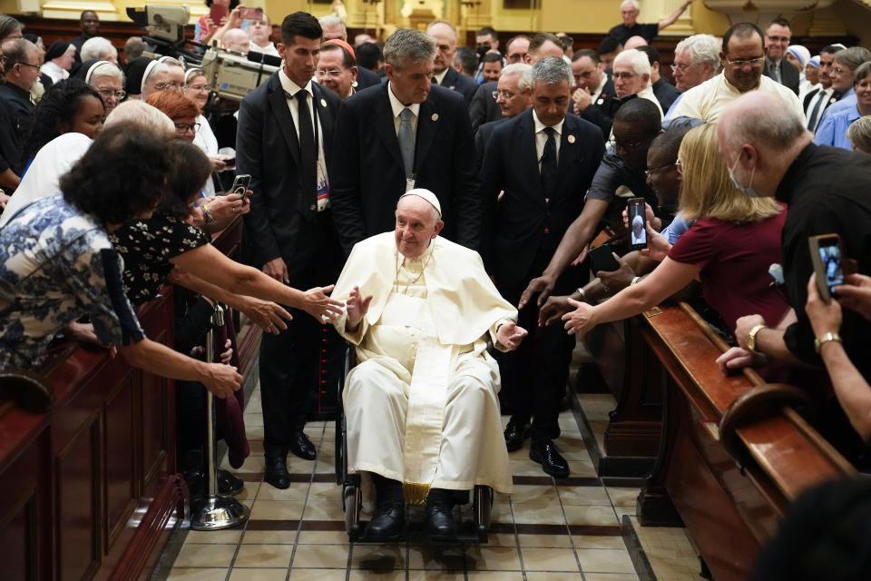 Pope Francis goes to pray by the remains of Saint Francois De Laval after presiding over a Vespers service at the Cathedral-Basilica of Notre Dame de Quebec, Thursday, July 28, 2022, in Quebec City, Quebec. Pope Francis crisscrossed Canada this week delivering long overdue apologies to the country's Indigenous groups for the decades of abuses and cultural destruction they suffered at Catholic Church-run residential schools. (AP Photo/John Locher)