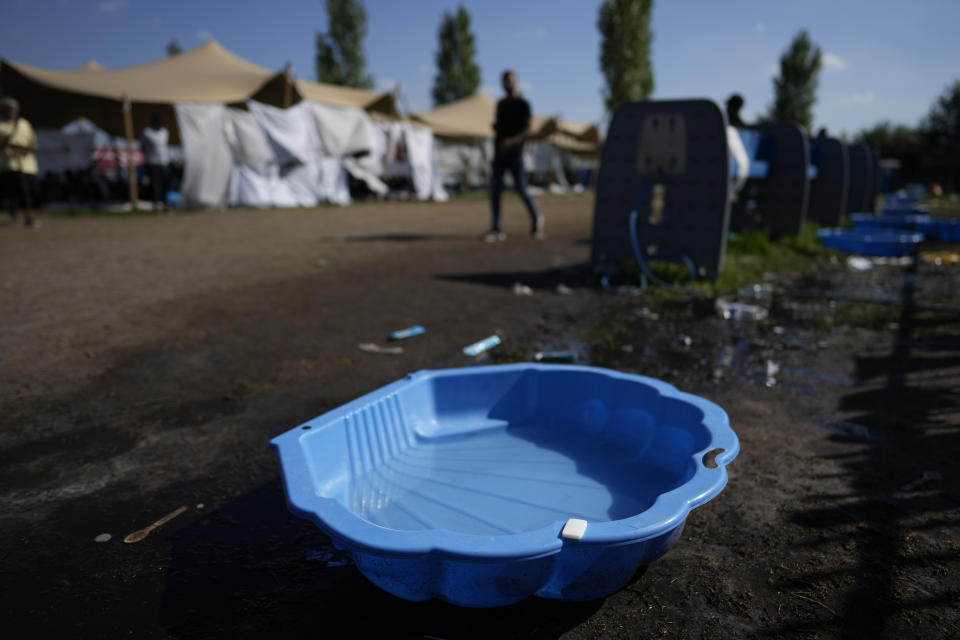 A piece of soap sat on a makeshift bathing facility where hundreds of migrants sought shelter outside an overcrowded asylum seekers center in Ter Apel, northern Netherlands, Thursday, Aug. 25, 2022. (AP Photo/Peter Dejong)