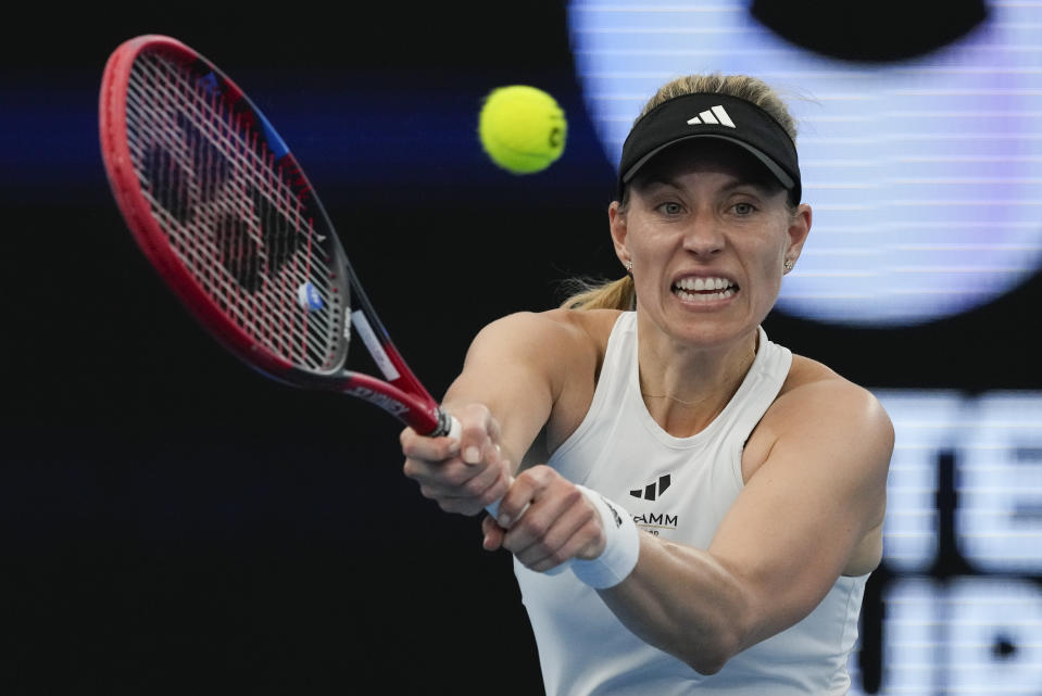 Germany's Angelique Kerber plays a backhand return to Poland's Iga Swiatek during the final of the United Cup in Sydney, Australia, Sunday, Jan. 7, 2024. (AP Photo/Mark Baker)