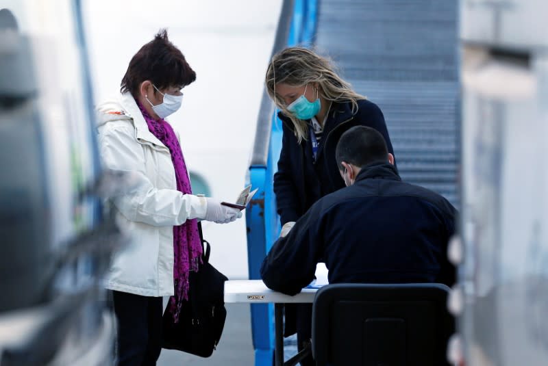 Passengers disembark from MSC Fantasia cruise ship in Lisbon