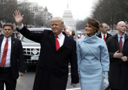 <p>U.S. President Donald Trump waves to supporters as he walks the parade route with first lady Melania Trump after being sworn in at the 58th Presidential Inauguration January 20, 2017 in Washington, D.C. Donald J. Trump was sworn in today as the 45th president of the United States (Evan Vucci/Getty Images) </p>