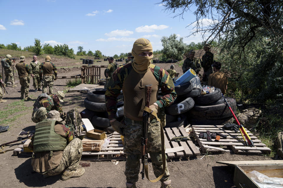 Convict prisoners who have joined the Ukrainian army train at the polygon, in the Dnipropetrovsk region, Ukraine, Saturday, June 22, 2024. Ukraine is expanding its military recruiting to cope with battlefield shortages more than two years into fighting Russia’s full-scale invasion. (AP Photo/Evgeniy Maloletka)