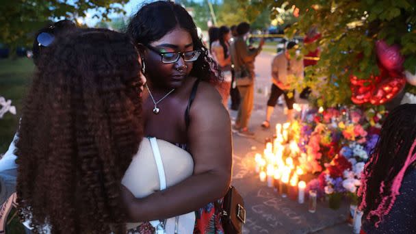 PHOTO: Mourners support each other while visiting a makeshift memorial outside of Tops market, May 15, 2022 in Buffalo, New York. (Scott Olson/Getty Images, File)