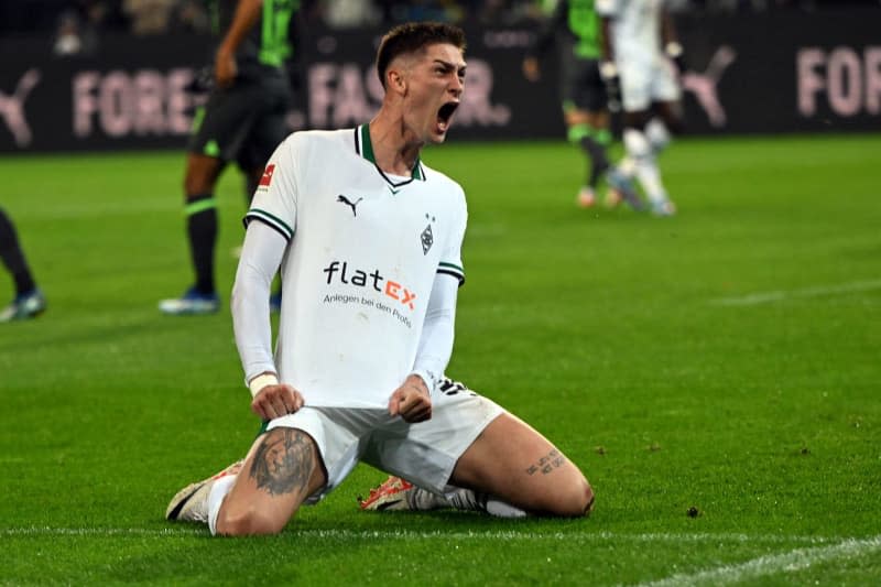 Gladbach's Tomas Cvancara celebrates his side's first goal of the game during the German Bundesliga soccer match between Borussia Moenchengladbach and VfL Wolfsburg at Borussia-Park. Federico Gambarini/dpa