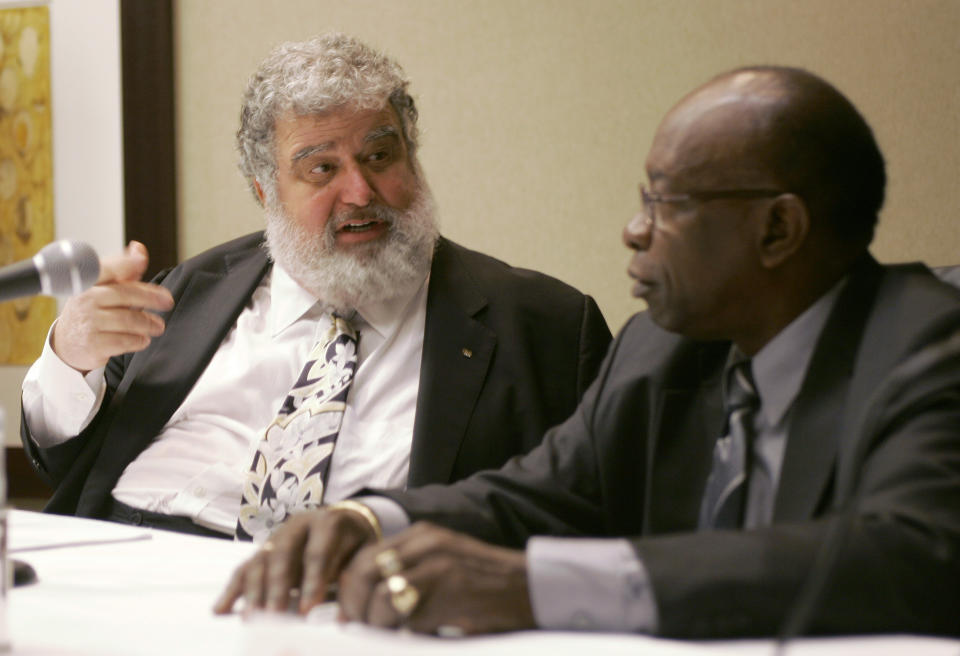 FILE - In this Jan. 28, 2008, CONCACAF General Secretary Chuck Blazer, left, and President Jack Warner chat during a news conference in Miami. Just ahead of the 2010 World Cup soccer bid, Diligence, a well-known private investigative firm in London founded by former western intelligence officers, was tasked to obtain communications and financial records of FIFA officials Warner and Blazer, a review of records obtained by The Associated Press show. Blazer, a former top U.S. soccer official who pleaded guilty to FIFA-related corruption charges and worked as an informant for the FBI, died in 2017. (AP Photo/Wilfredo Lee, File)