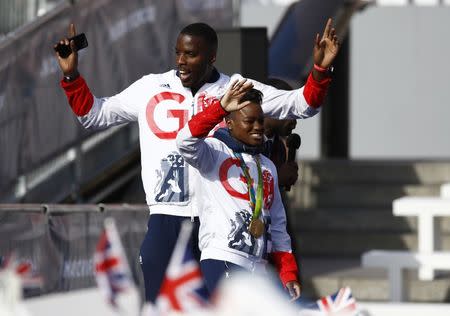 Britain Olympics - Team GB Homecoming Parade - London - 18/10/16 Nicola Adams and Lawrence Okolie of Britain during the parade Action Images via Reuters / Peter Cziborra