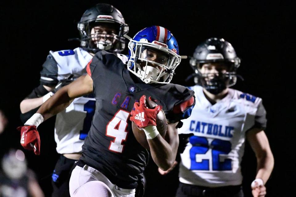 Christian Academy-Louisville’s Justin Ruffin (4) crosses the goal line to score during the first half against Lexington Catholic.