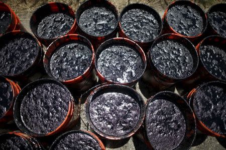 Buckets of oil volunteers carried from an oil slick along the coast of Refugio State Beach in Goleta, California, United States, May 20, 2015. REUTERS/Lucy Nicholson