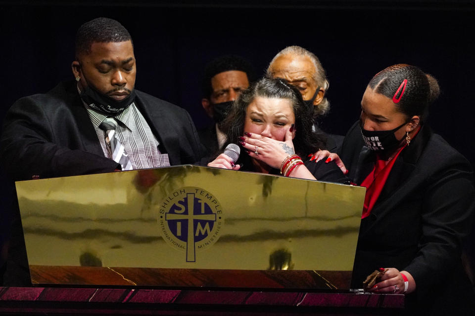 CORRECTS SPELLING OF FIRST NAME TO ARBUEY, NOT AUBREY - Katie and Arbuey Wright, parents of Daunte Wright, cry as the speak during funeral services of Daunte Wright at Shiloh Temple International Ministries in Minneapolis, Thursday, April 22, 2021. Wright, 20, was fatally shot by a Brooklyn Center, Minn., police officer during a traffic stop. (AP Photo/Julio Cortez, Pool)
