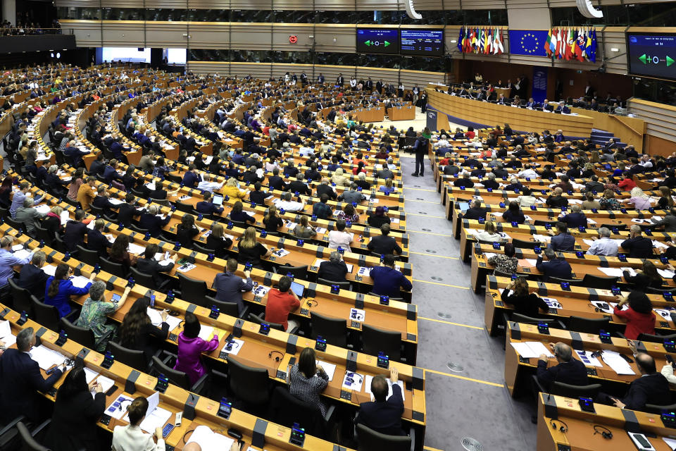 FILE - Members of European Parliament participate in a series of votes as they attend a plenary session at the European Parliament in Brussels, on April 10, 2024. The European Union marks Europe Day on Thursday, May 9, but instead of the traditionally muted celebrations, all eyes are on the EU elections in one month time which portend a steep rise of the extreme right and a possible move away from its global trendsetting climate policies. (AP Photo/Geert Vanden Wijngaert, File)