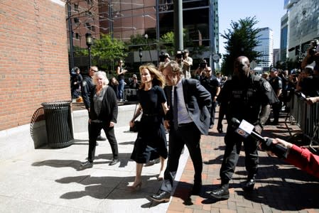 Actress Felicity Huffman and husband William H. Macy arrive at the federal courthouse in Boston