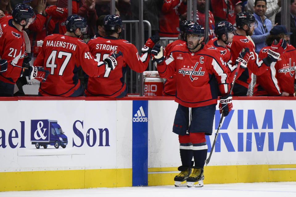 Washington Capitals left wing Alex Ovechkin (8) is congratulated for his goal against the Toronto Maple Leafs during the second period of an NHL hockey game Tuesday, Oct. 24, 2023, in Washington. (AP Photo/Nick Wass)