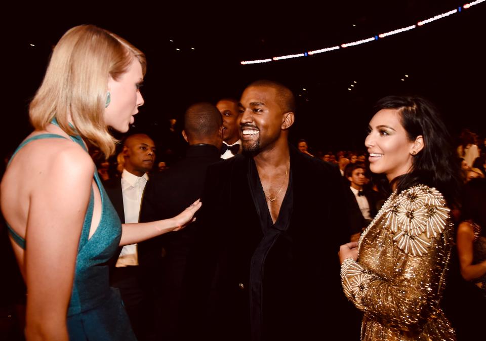 Taylor Swift, Kanye West, and Kim Kardashian photographed together during an amicable spell in 2015 at the Grammys.