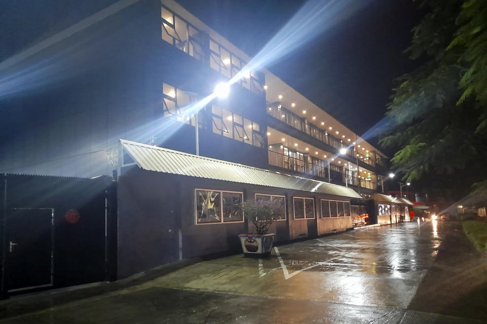 Floodlights illuminate the Chinese Embassy after a rain in Honiara, Solomon Islands, Friday, April 1, 2022. Seeking to counter international fears over its new security alliance with China, the Solomon Islands said it won't allow China to build a military base there. (AP Photo/Charley Piringi)