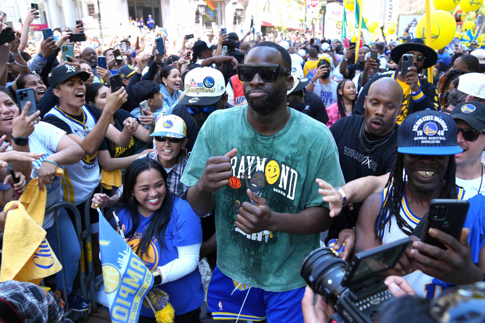 Warriors forward Draymond Green walks amongst the fans during Golden State's championship parade.