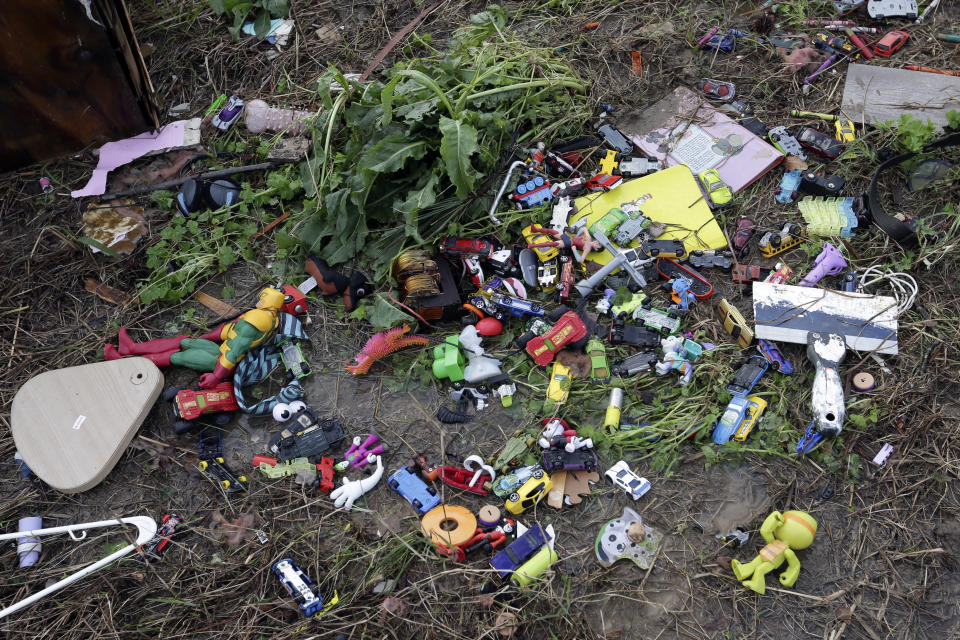 Debris scatters the landscape after a tornado touched down damaging multiple homes Friday, March 26, 2021 in Wellington, Ala. A tornado outbreak has ripped across the Deep South leaving paths of destruction. (AP Photo/Butch Dill)