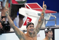 Caeleb Dressel of the United States celebrates winning the men's 100-meter freestyle final at the 2020 Summer Olympics, Thursday, July 29, 2021, in Tokyo, Japan. (AP Photo/Matthias Schrader)