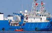 Chinese fishermen are pictured at a ship in the disputed Scarborough Shoal April 6, 2017. Picture taken April 6, 2017. REUTERS/Erik De Castro