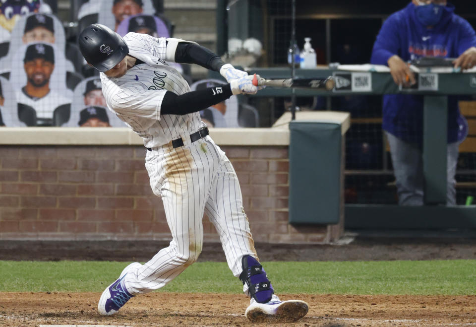 Colorado Rockies' Trevor Story connects for a double off Texas Rangers starting pitcher Kyle Gibson in the fifth inning of a baseball game Saturday, Aug. 15, 2020, in Denver. (AP Photo/David Zalubowski)