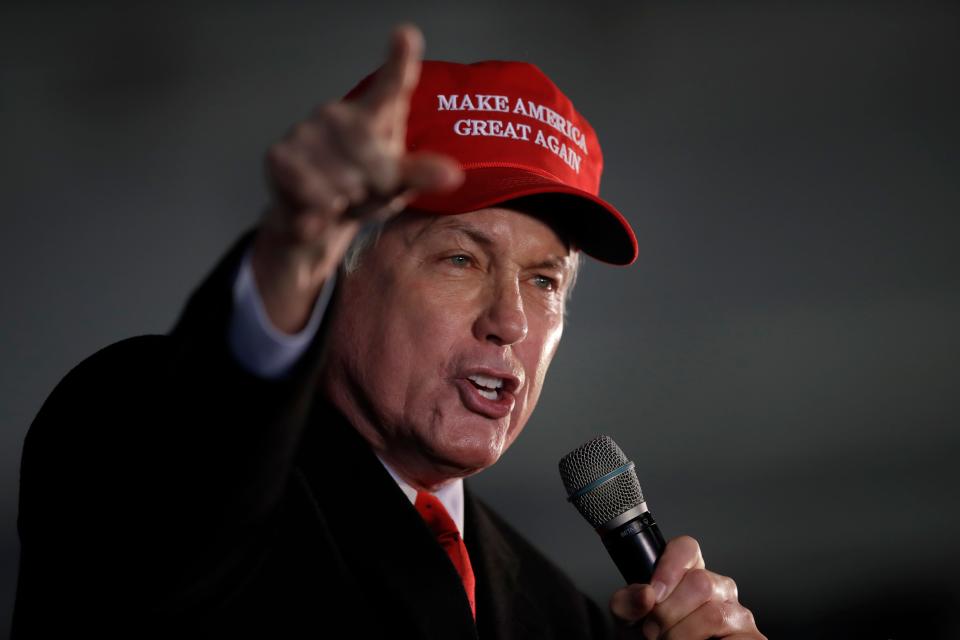 Attorney Lin Wood, member of President Donald Trump's legal team, gestures while speaking during a rally on Dec. 2, 2020, in Alpharetta, Georgia.