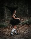 <p>Who says a witch costume can't be pretty? A pair of striped socks and a spooky hat are all you need to transform a simple tutu and leotard. </p><p><strong>Get the tutorial at <a href="https://chanelmovingforward.com/2018/09/baddest-witch-in-the-west-halloween-costume.html" rel="nofollow noopener" target="_blank" data-ylk="slk:Chanel Moving Forward;elm:context_link;itc:0;sec:content-canvas" class="link ">Chanel Moving Forward</a>. </strong> </p><p><strong><a class="link " href="https://www.amazon.com/OULII-Girls-Striped-Stockings-Year-old/dp/B076ZL2RR5/ref=sr_1_5?tag=syn-yahoo-20&ascsubtag=%5Bartid%7C10050.g.28304812%5Bsrc%7Cyahoo-us" rel="nofollow noopener" target="_blank" data-ylk="slk:SHOP STRIPED SOCKS;elm:context_link;itc:0;sec:content-canvas">SHOP STRIPED SOCKS</a></strong> </p>