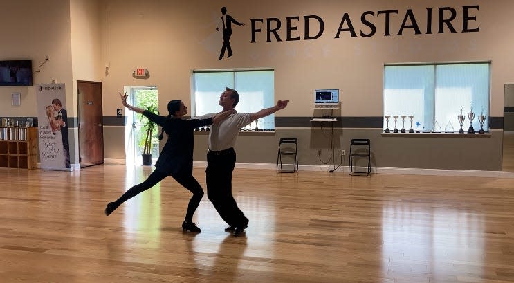 Iryna Savushkina and Roman Doroshenko perform an elegant dance routine worthy of their shop's namesake, The Fred Astaire Dance Studio in Newtown Township on Wednesday May 1, 2024.
