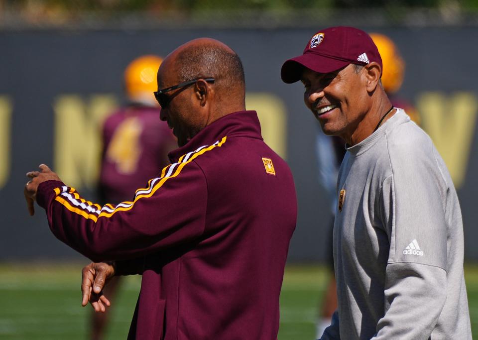 March 30, 2022;  Tempe, AZ, USA; ASU's head coach Herm Edwards and Ray Anderson, Vice President for University Athletics, talk along the sidelines during a practice at Kajikawa Practice fields.