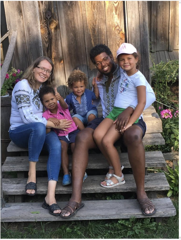 Tatiana Poladko and Atnre Alleyne with their children outside the Pyrohovo Open-Air Museum in Kyiv. (Bonita Penn)