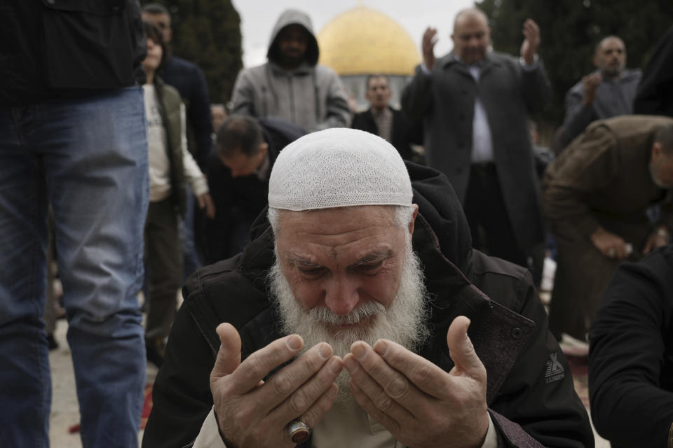 Muslims take part in Friday prayers at the Dome of the Rock Mosque in the Al-Aqsa Mosque compound in the Old City of Jerusalem, Friday, Feb. 24, 2023. (AP Photo/Mahmoud Illean)