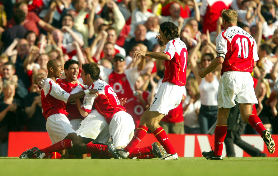 Reyes celebrates his goal with the rest of the squad - who will go on to be labelled 'Invincibles' (Photo by Mike Egerton - EMPICS/PA Images via Getty Images)