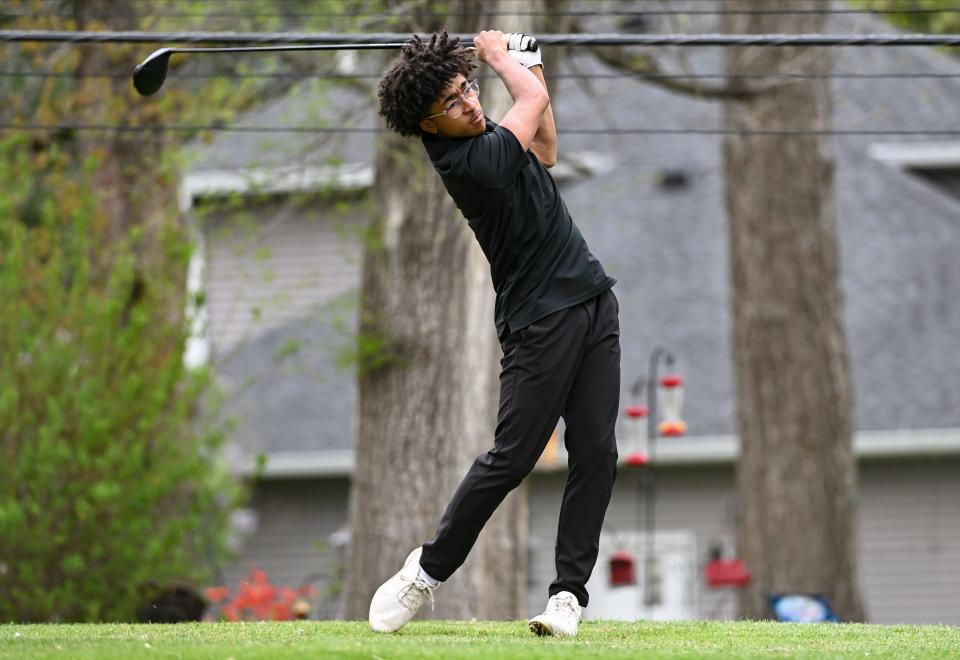 Edgewood’s Carter Cheaney hits a tee shot during the golf match against Bloomington South at Cascades Golf Course on Tuesday, April 9, 2024.