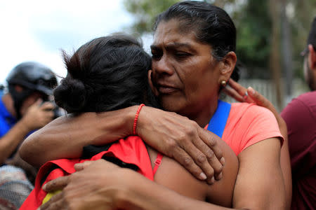 Relatives of opposition activists jailed for protesting against President Nicolas Maduro react as they arrive by bus to a detention centre of the Bolivarian National Intelligence Service (SEBIN) in Caracas, Venezuela June 1, 2018. REUTERS/Marco Bello