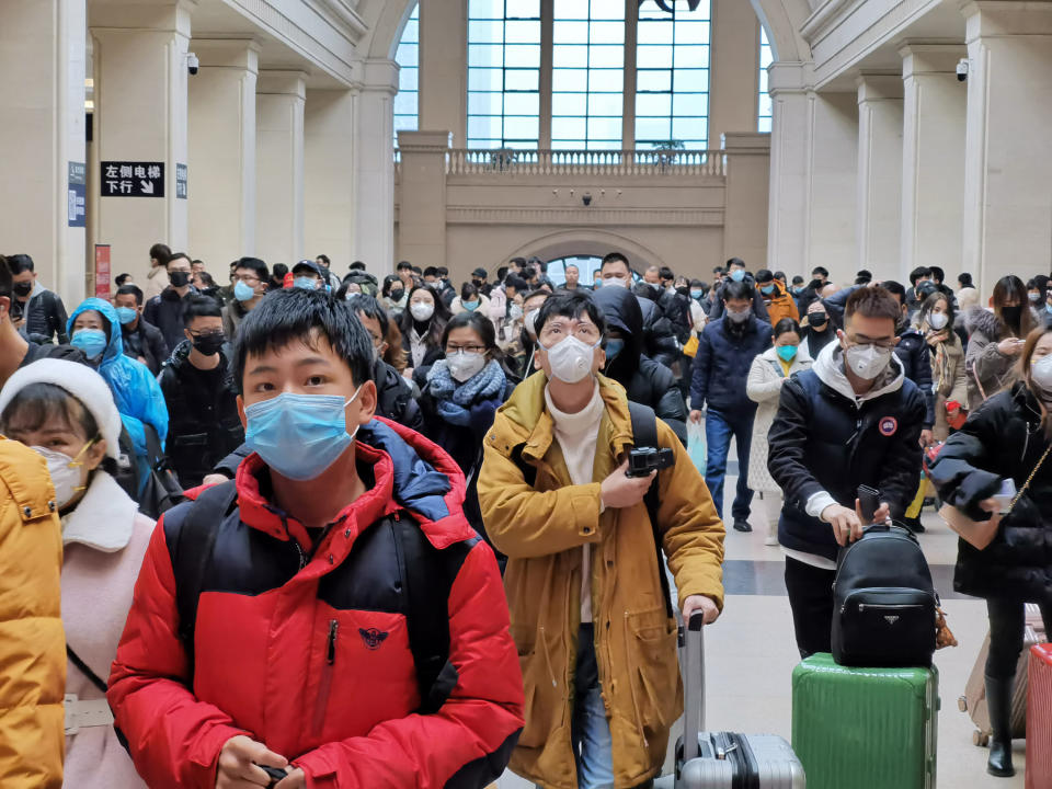 Large crowd of people are seen wearing protective masks in China. Source: Xiaolu Chu/Getty Images