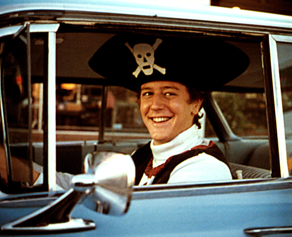 Judge Reinhold driving while wearing a pirate hat