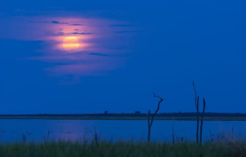 Moonrise at sunset on Lake Kariba - Credit: iStock